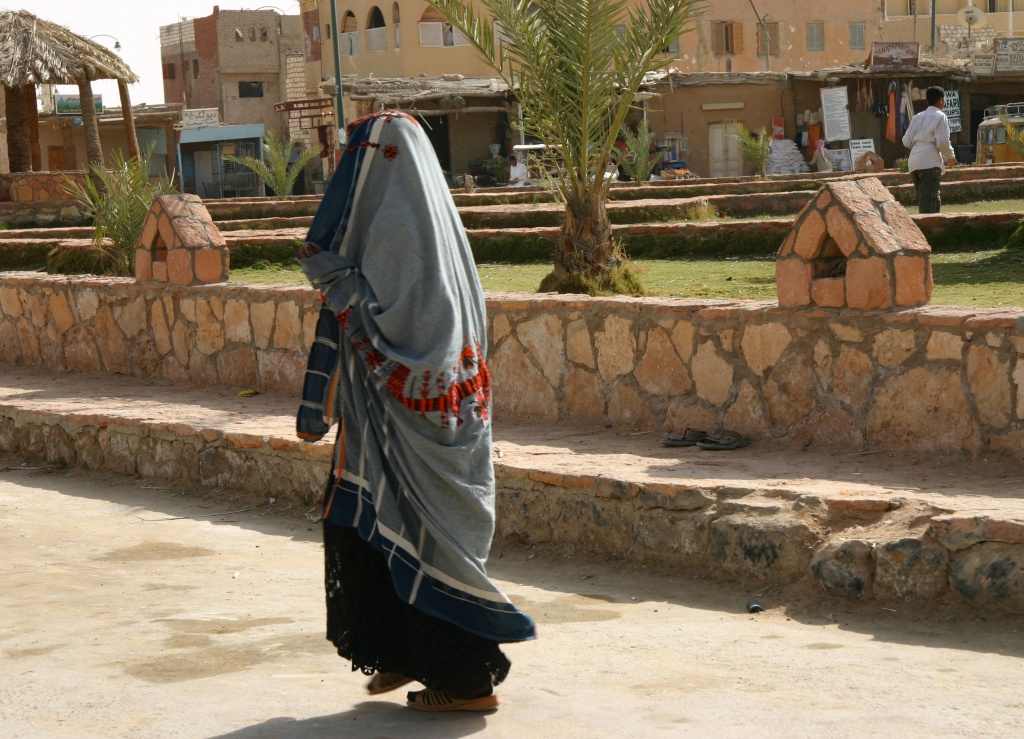 The Issiwane woman only leaves her home with her head and face covered by a veil, revealing only her eyes.