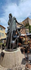 Salon-de-Provence. This bronze statue of Nostradamus holding various symbols in his hands was created by sculptor François Bouché (1924-2005).