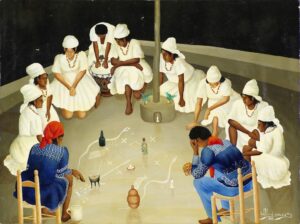 Wilfrid Daleus (1949-2017), Veillée vaudou dans un péristyle, 1988. Peinture sur toile. Au sol, les symboles tracés avec de la farine de maïs (vèvès) servent à appeler les divinités (loas), à condition d’être activés par des libations d’alcool, des bougies et des paquets congo. Assis sur des chaises basses ou agenouillés, les initiés (dont la couleur des vêtements se rapportent à leur degré d’élévation spirituelle et au courant de tradition adopté) récitent les chants rituels. © musée du quai Branly – Jacques Chirac, photo Patrick Gries.