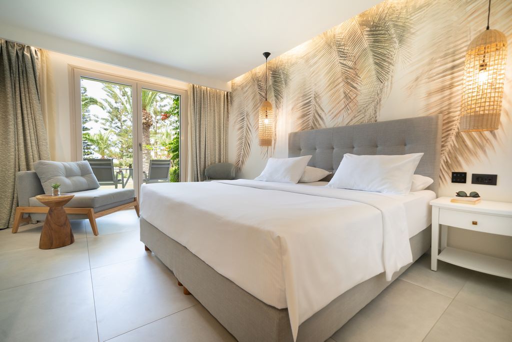 Crete. Hotel Iberostar Creta Marine. In this light-filled room, every detail exudes tranquillity, providing an elegant retreat in which to bask.