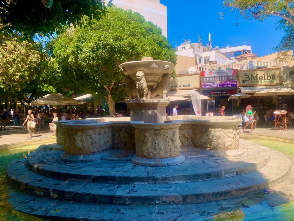 Crete. The Morosini Fountain, a 17th-century Venetian masterpiece, is surrounded by terraces where you can enjoy café frappés. M. Lasseur.
