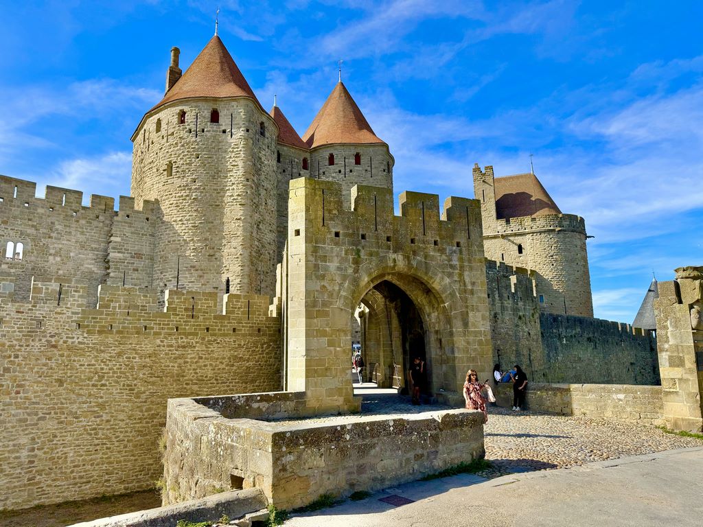 France. Carcassonne. The main gateway to the medieval town, the Porte Narbonnaise was built around 1280. It consists of two huge spur-shaped towers.