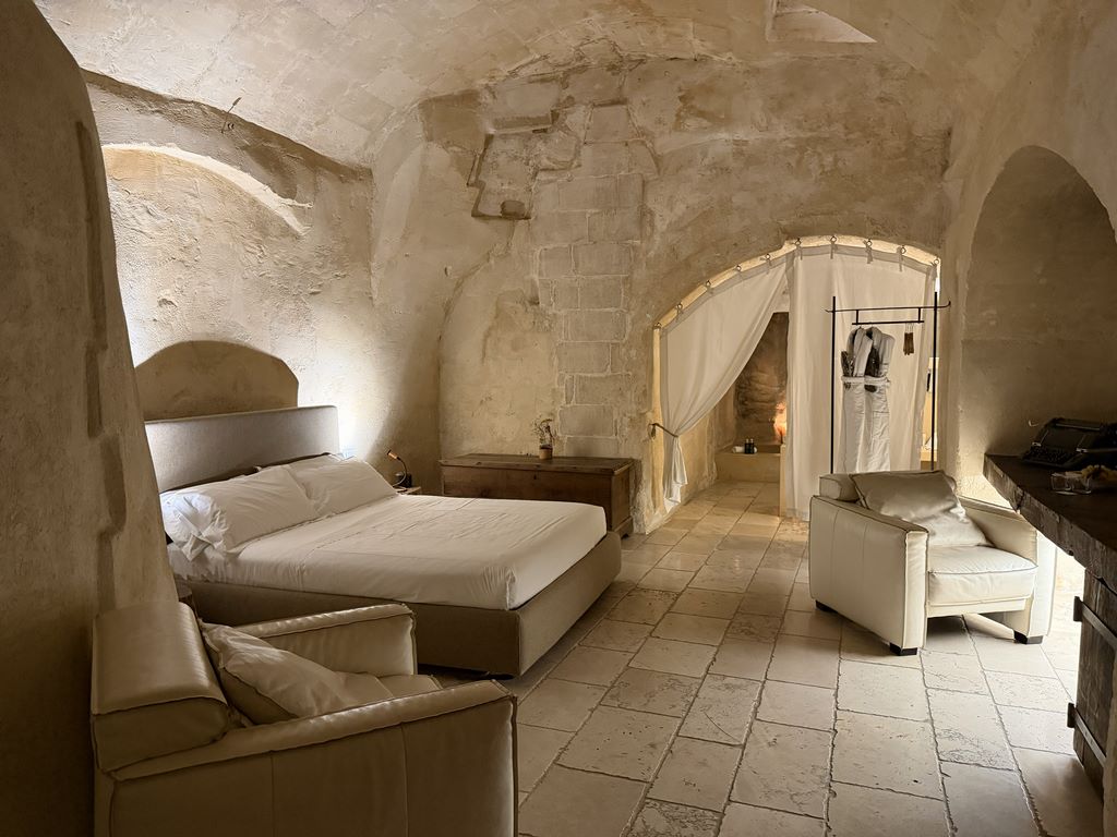 Italy. Matera. Boutique hotel Corte San Pietro. Where time stands still and stone tells the story: experience the magic of the Sassi in a suite with private spa, designed to regenerate body and soul.