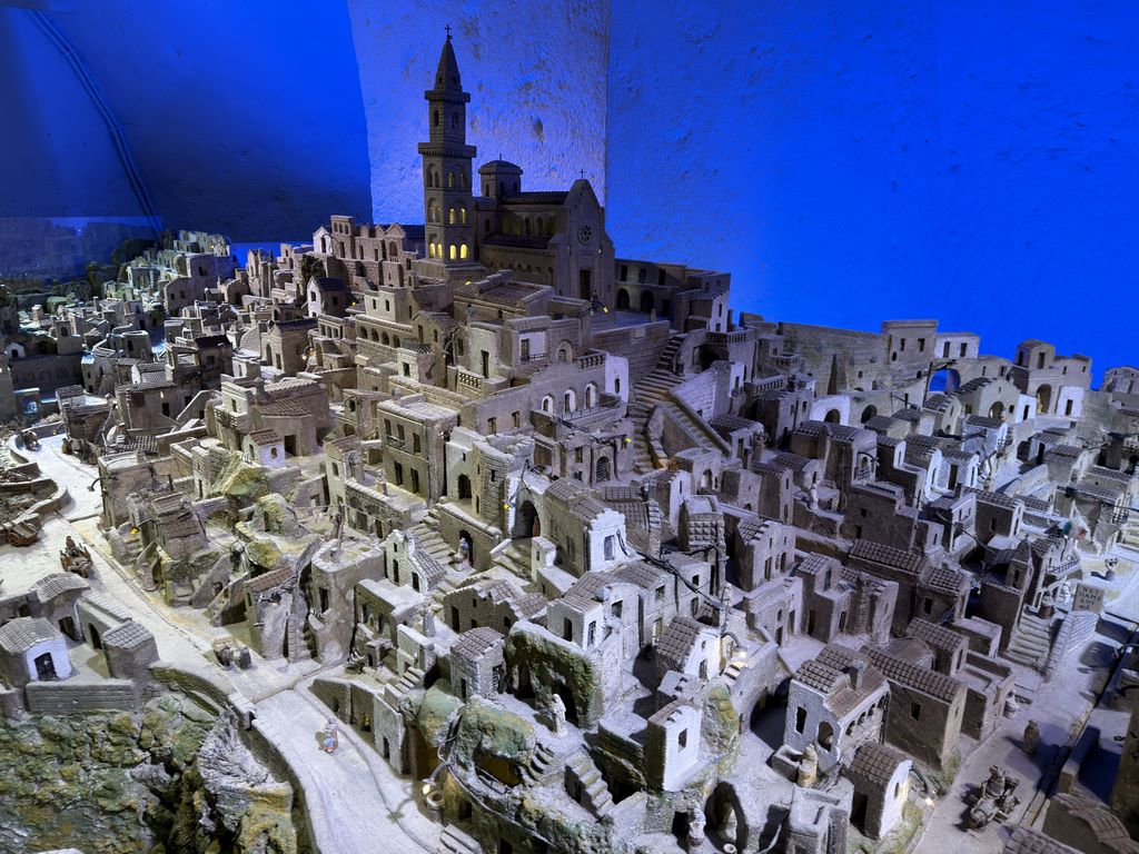 Italy. Matera. Eustachio, a nonagenarian who is still active, likes to present his "great work", a gigantic model of the Sassi, carved entirely out of tufa, a work of several years' duration, which is displayed with colourful, changing lighting in another annex of the family tourist complex.